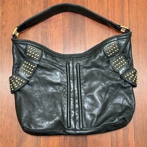 Treesjee black leather studded shoulder bag.